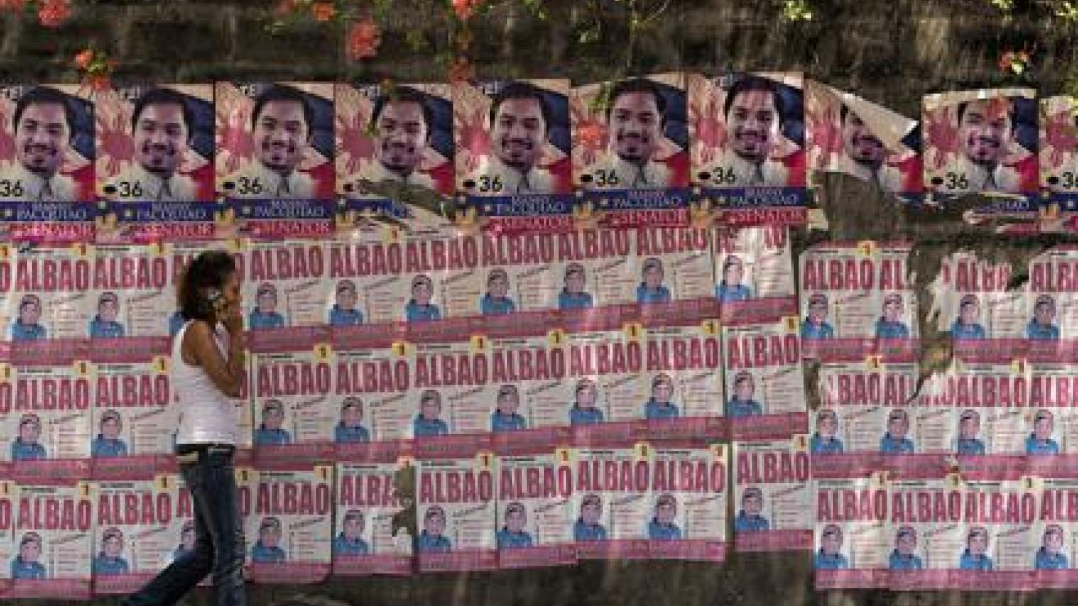 Wall plastered with election material, ahead of the Philippine local and National Election on the 9th May. Bacolod City, Philippines. Image by Brian Evans on Flickr under the CC BY-NC-ND 2.0 license.