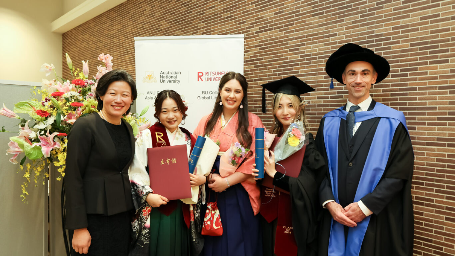 Graduates with RU staff and Dr Christopher Hobson from ANU